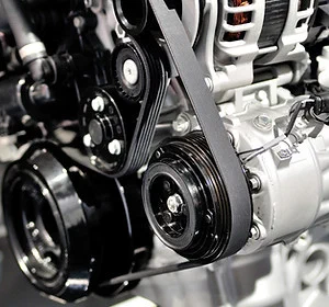 Aircon compressor and drive belt Air conditioning compressor and drive belt in an engine bay